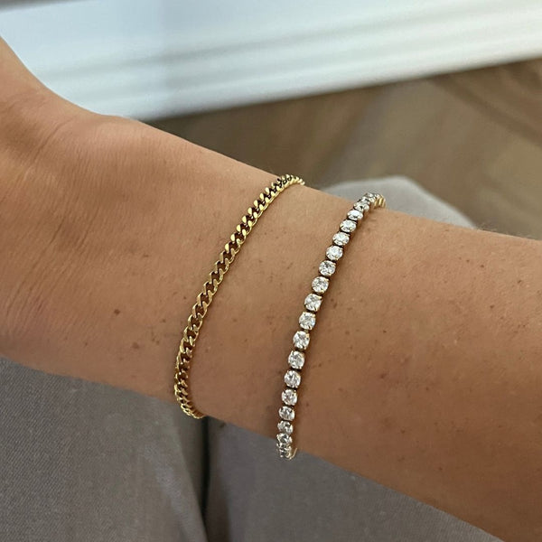 Panser armbånd i 18K guldbelagt rustfrit stål med facetteret design.
